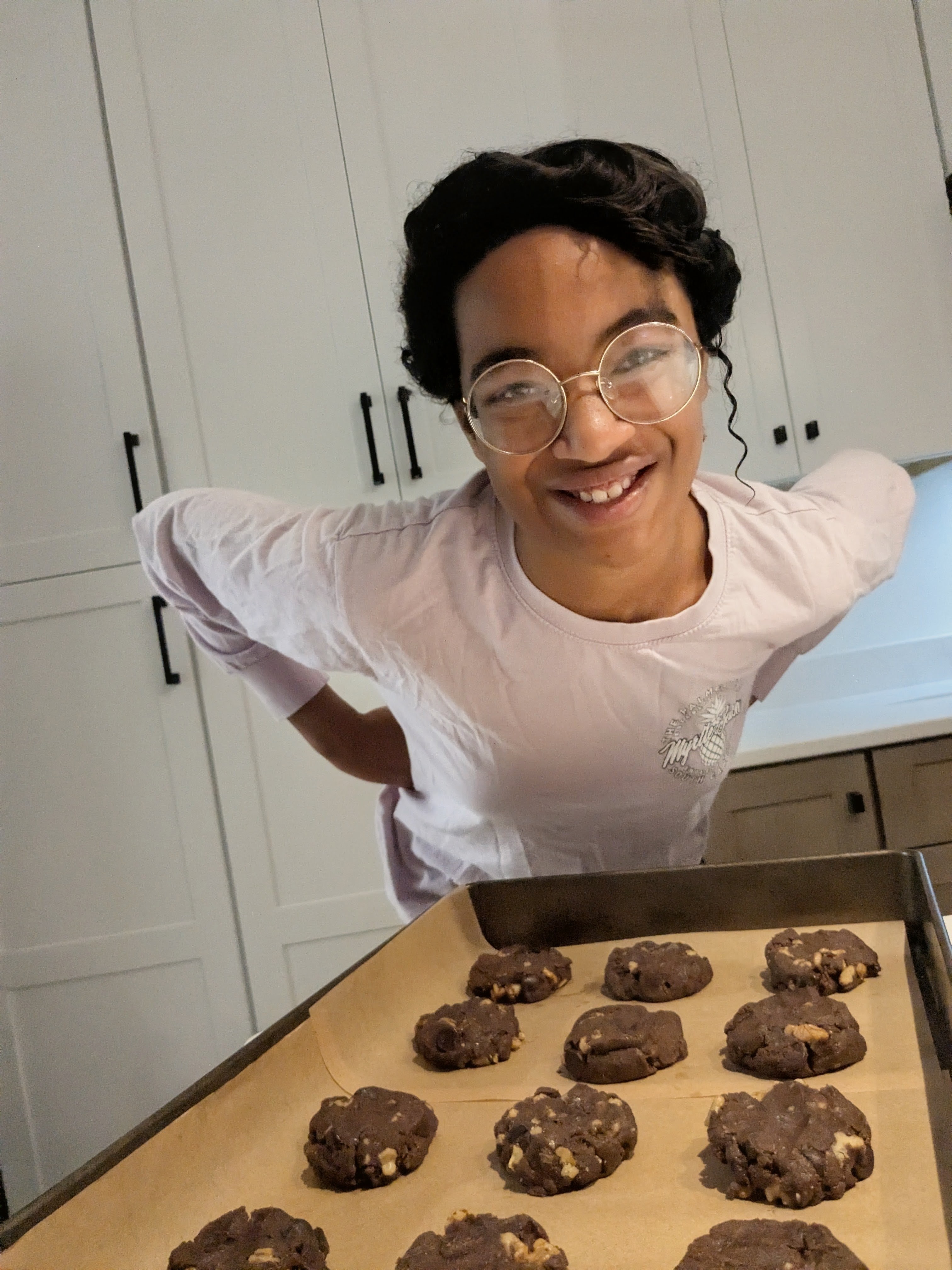Moriah with a tray of chocolate cookies